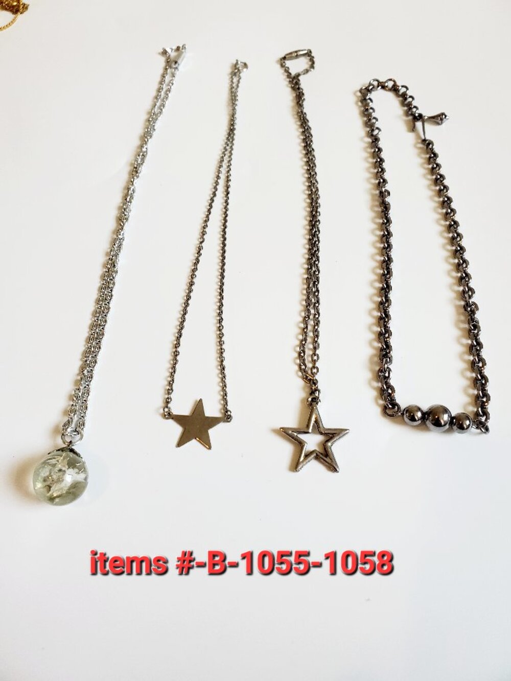 4 silver chain necklaces, items # B-1055-1058,. wt . 27 grams .